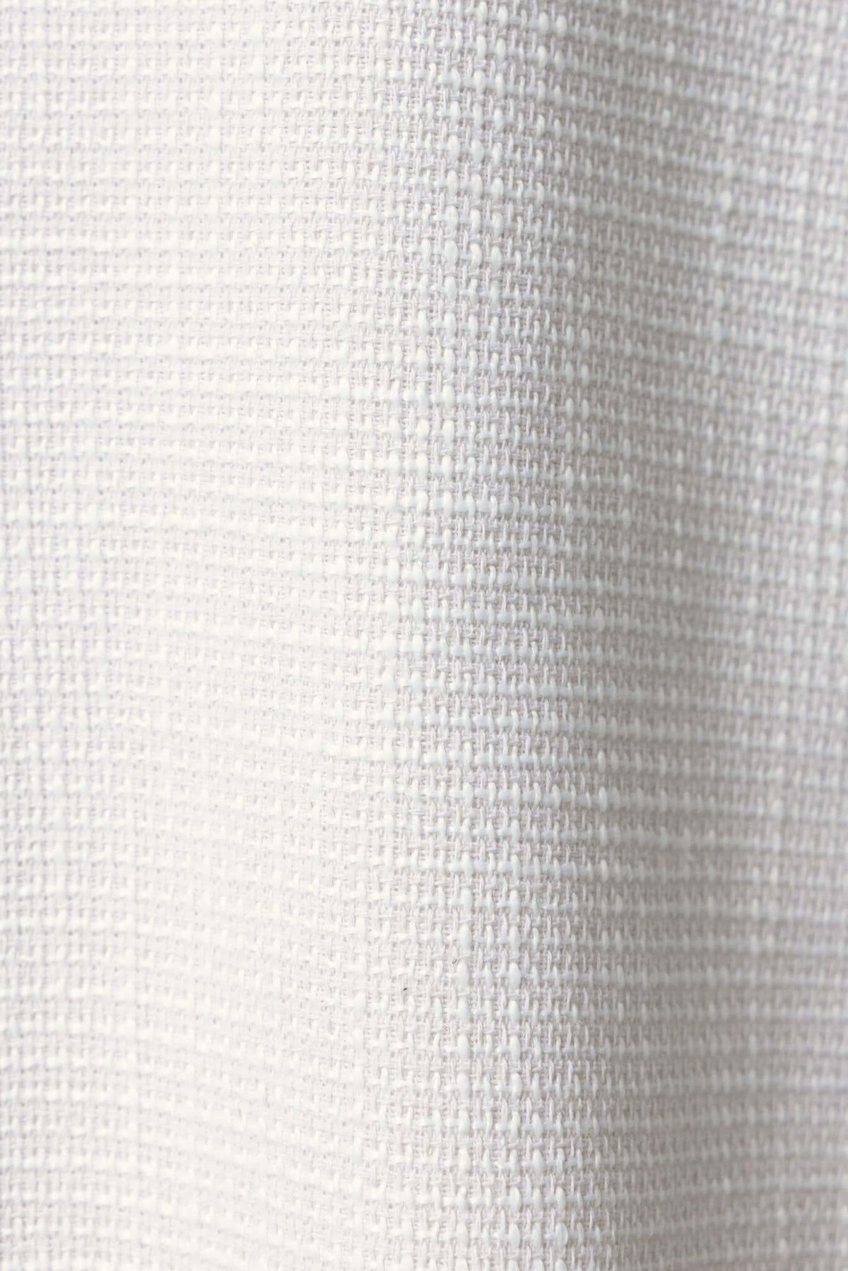 Close-up of white chenille fabric texture, showcasing the woven pattern and softness.