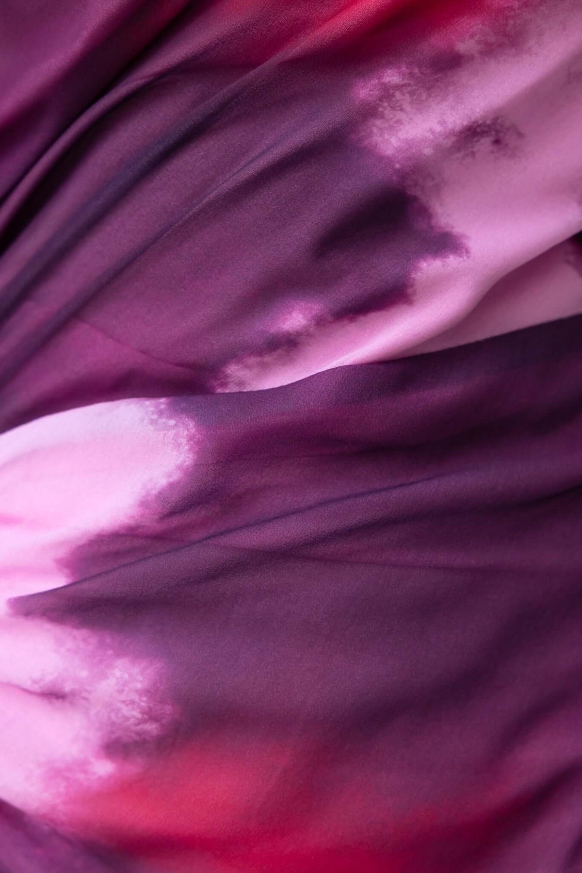 Close-up of purple and pink fabric showcasing the unique tie-dye pattern of the Jules Maxi Dress.