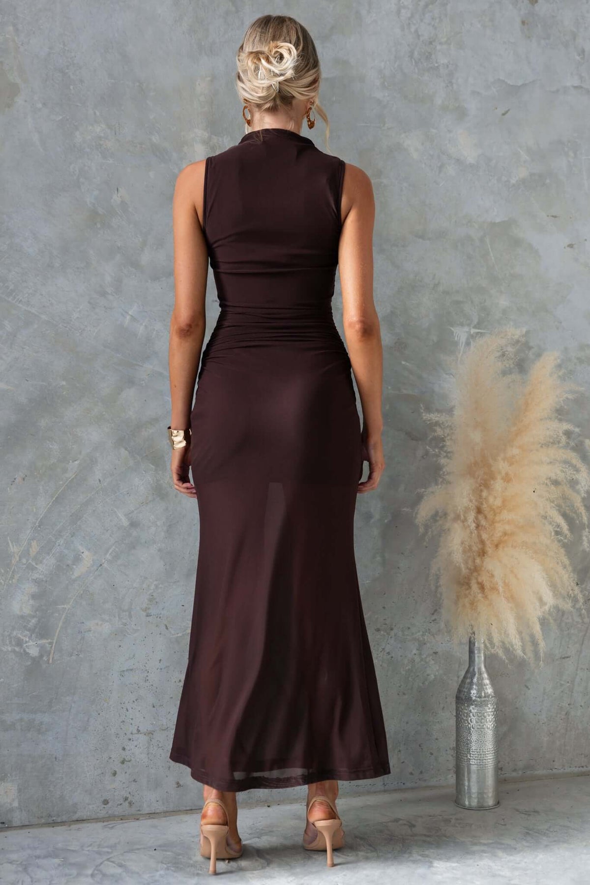 Back view of Karter Maxi Dress featuring high neckline, draping waist, and mesh material in a stylish look.
