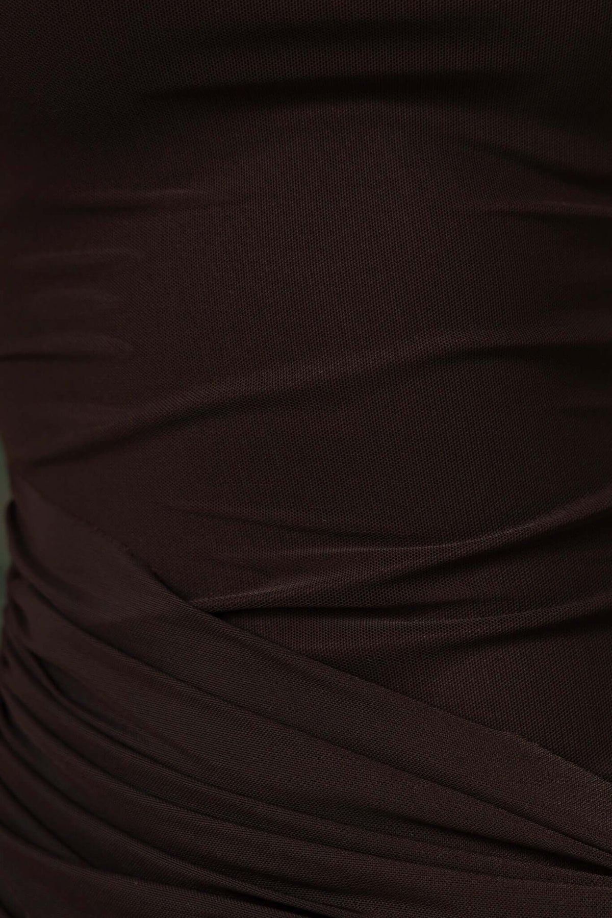 Close-up of dark fabric showing draping material and texture of the Karter Maxi Dress.