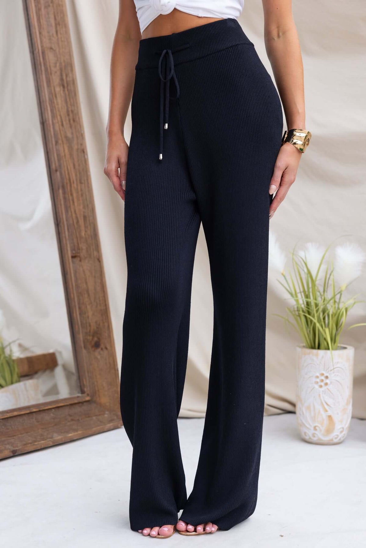 Fashionable Keene Pants in black, featuring a mid-high waist, elastic waistband, and soft knit ribbed material.