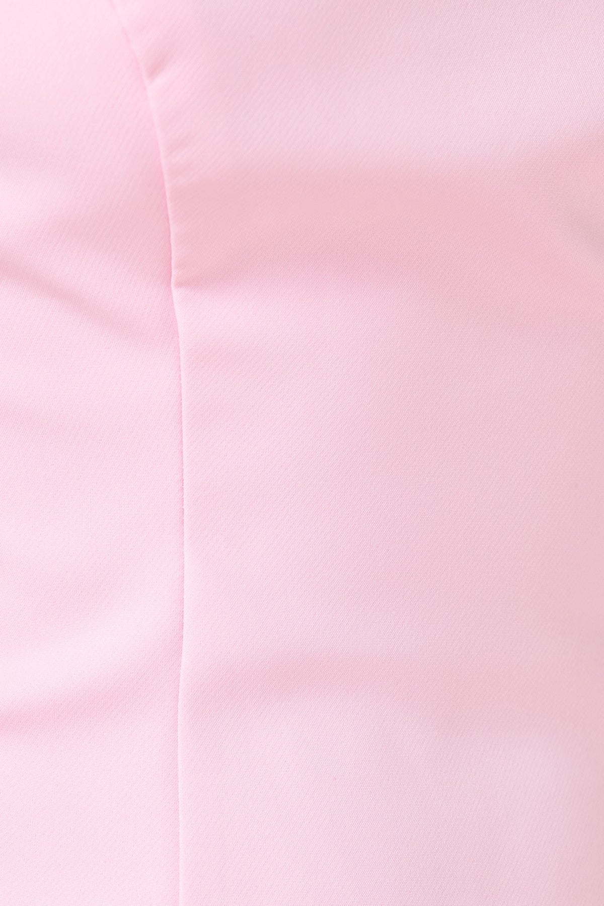 Close-up of soft pink fabric texture of Kenna Dress, showcasing its smooth polyester material.
