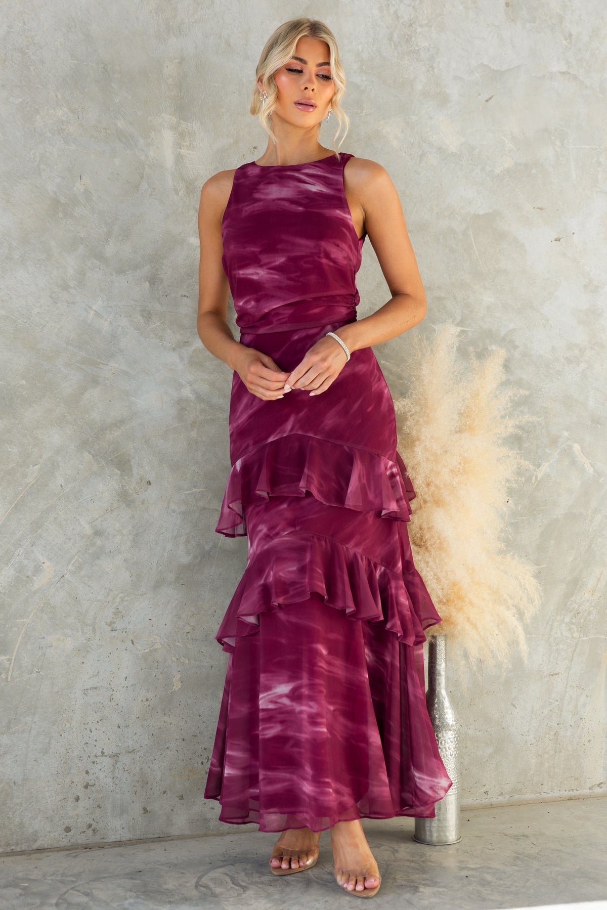 Kilian Maxi Dress in deep purple with tiers, featuring a high neckline and elegant design, perfect for special occasions.