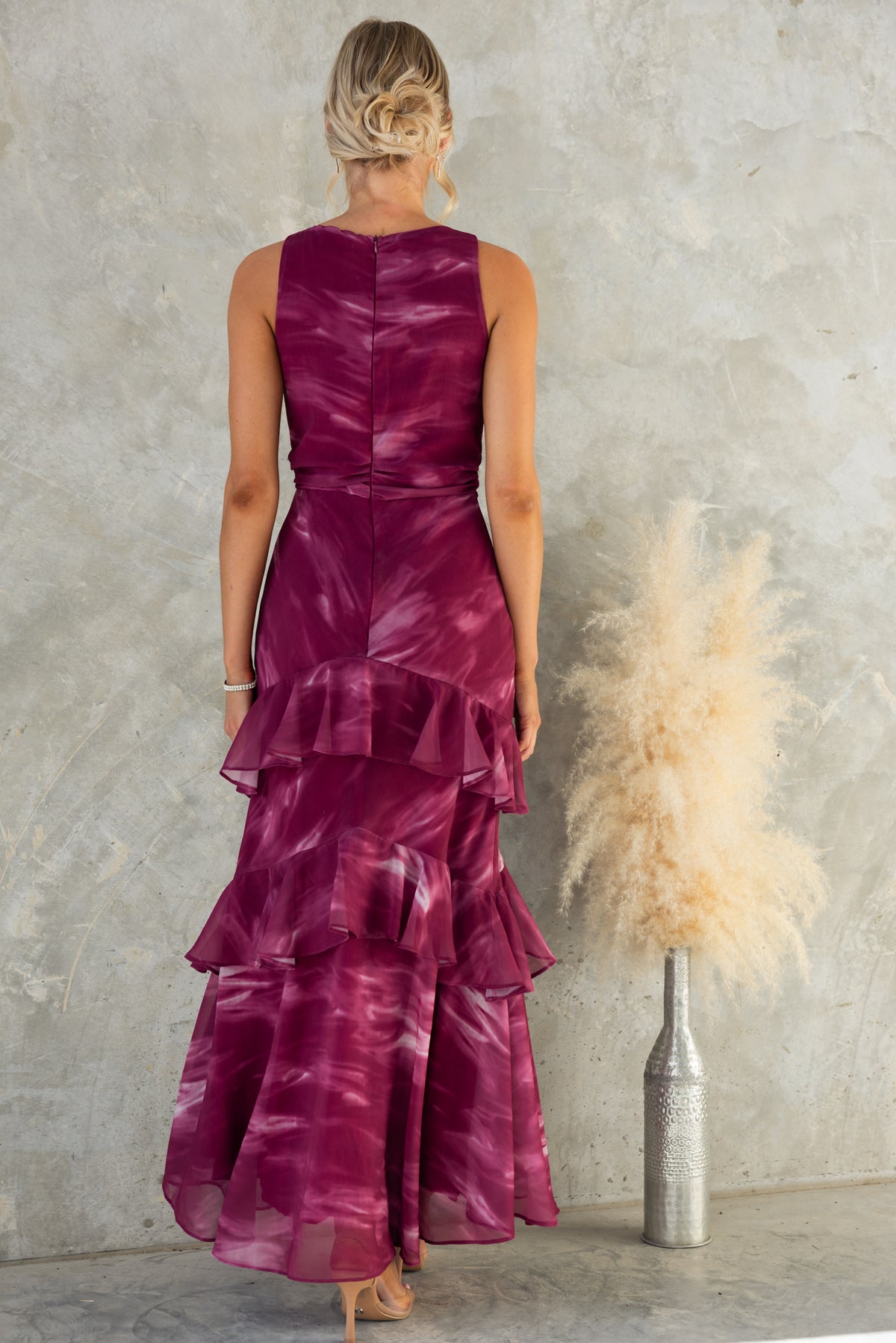 Back view of Kilian Maxi Dress in burgundy, featuring layered frills and a high neckline in a stylish design.