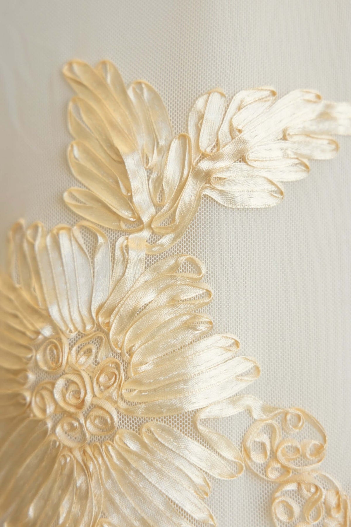 Detailed embroidery of floral patterns on the Korren Maxi Dress, showcasing elegance and craftsmanship.