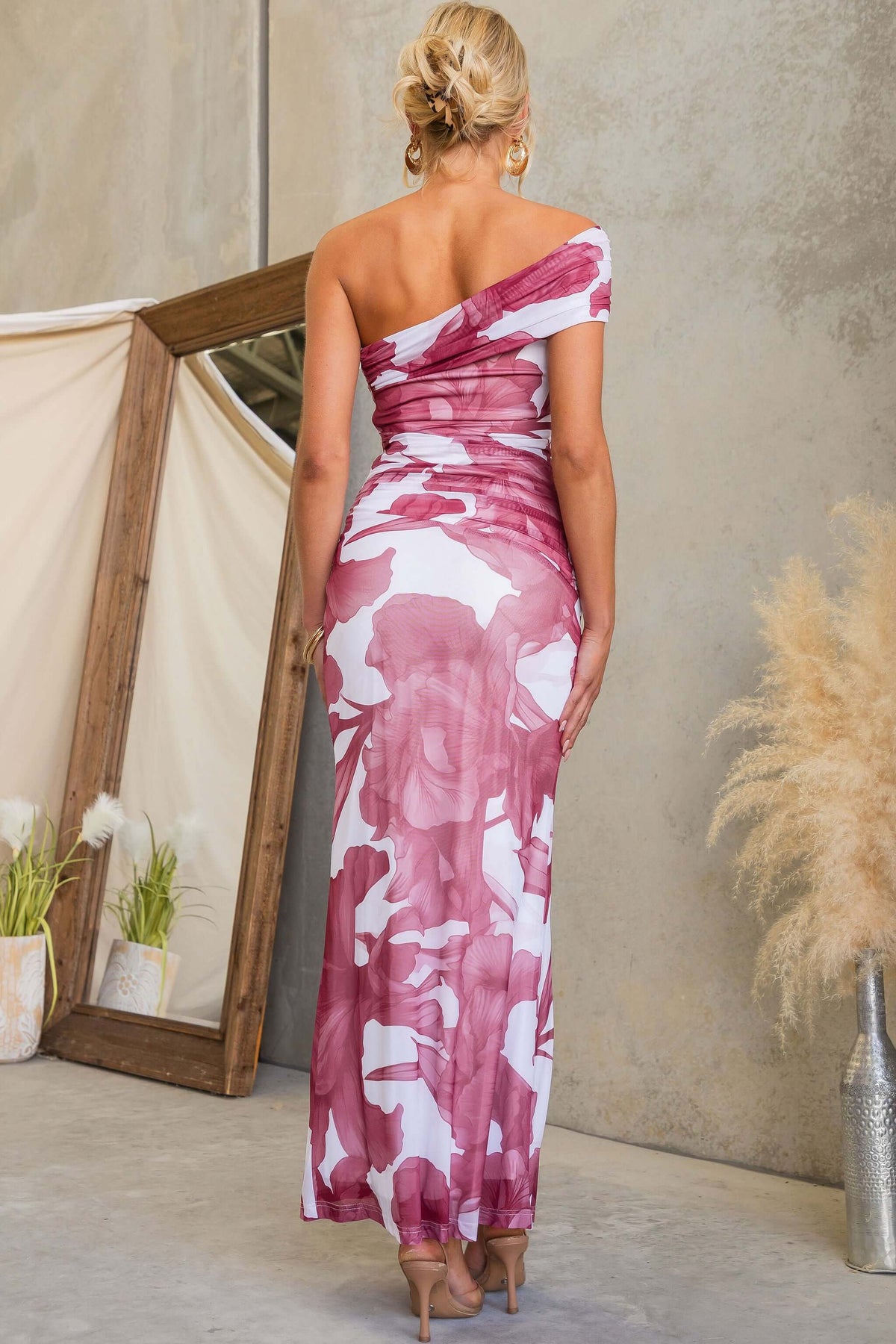 Korren Maxi Dress showcasing a one-shoulder design and floral print from the back view.