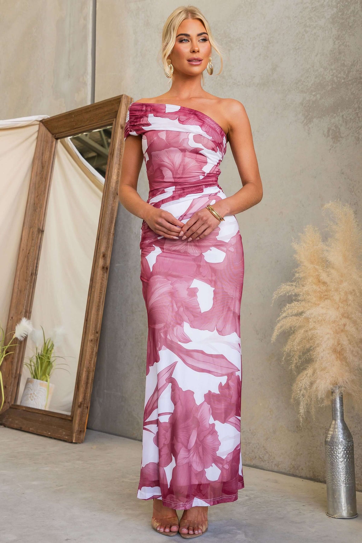Model wearing Korren Maxi Dress with one-shoulder neckline and mesh metallic material.