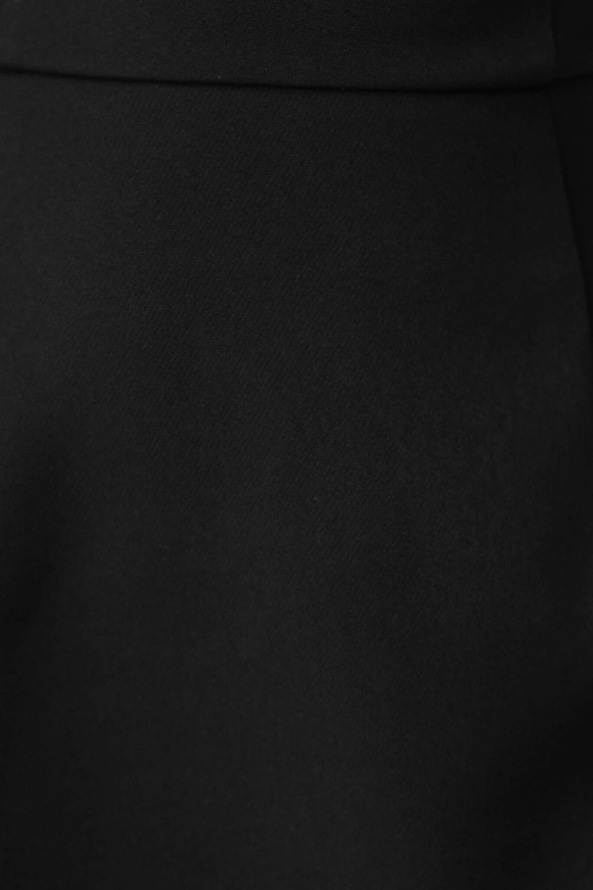 Close-up of Laredo Top's smooth black fabric, showcasing the quality material and elegant style.