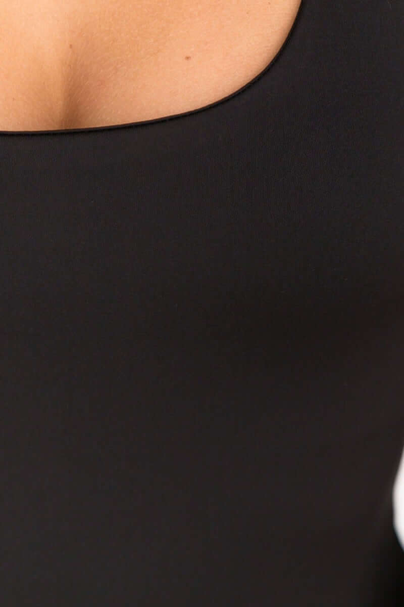 Close-up of Layla Top by Amaroso the Label, featuring wide scoop neckline and stretchy black lycra material.