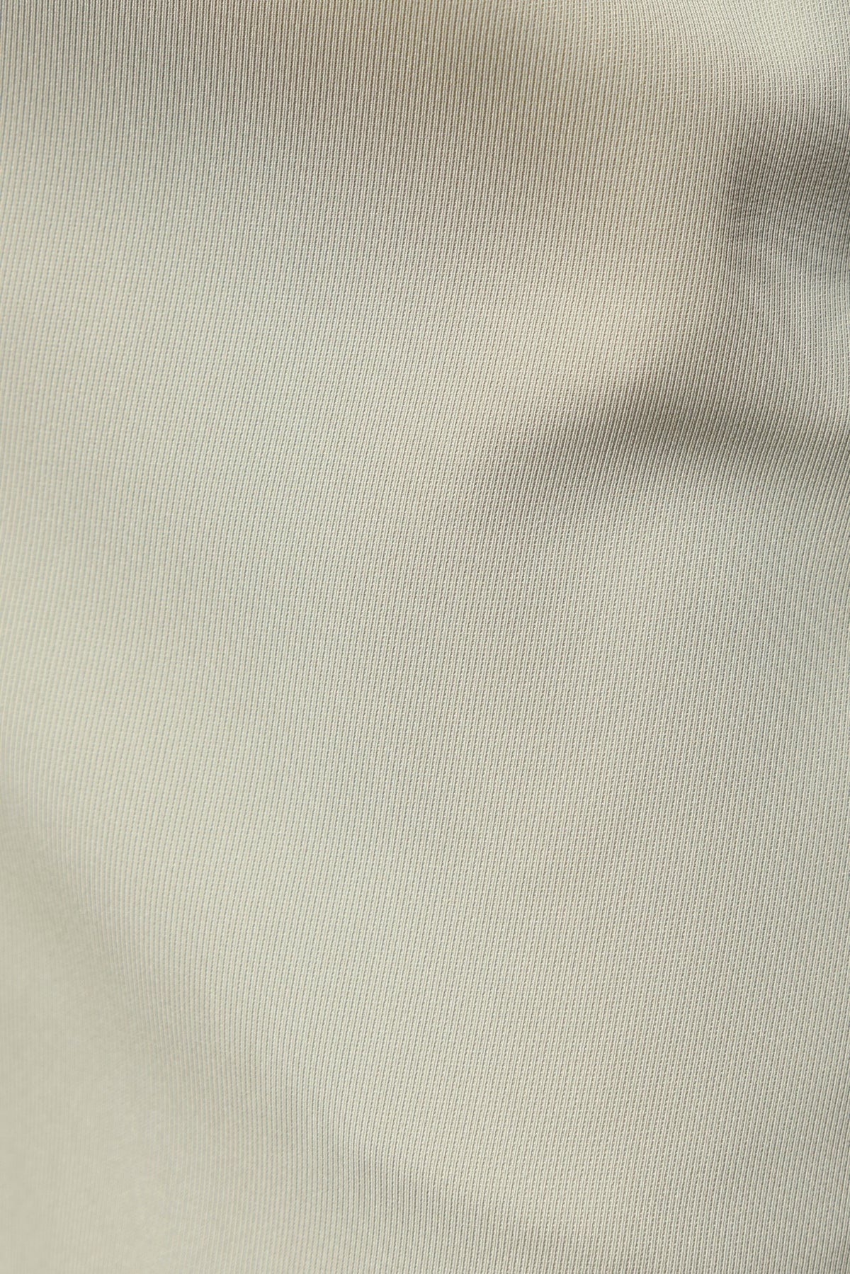 Close-up texture of Lesky Pants fabric, showcasing the fine detailing and color accuracy for shoppers.