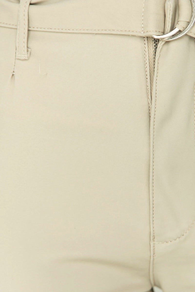 Close-up of Mrs Smith pants featuring a removable fabric belt and firm stretch material in a neutral color.