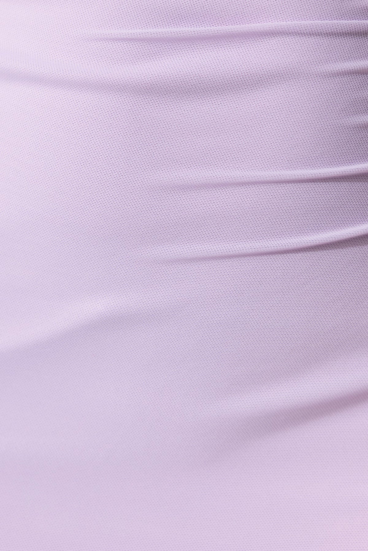 Close-up of light purple mesh fabric showcasing the textured design of the Maloja Maxi Dress.