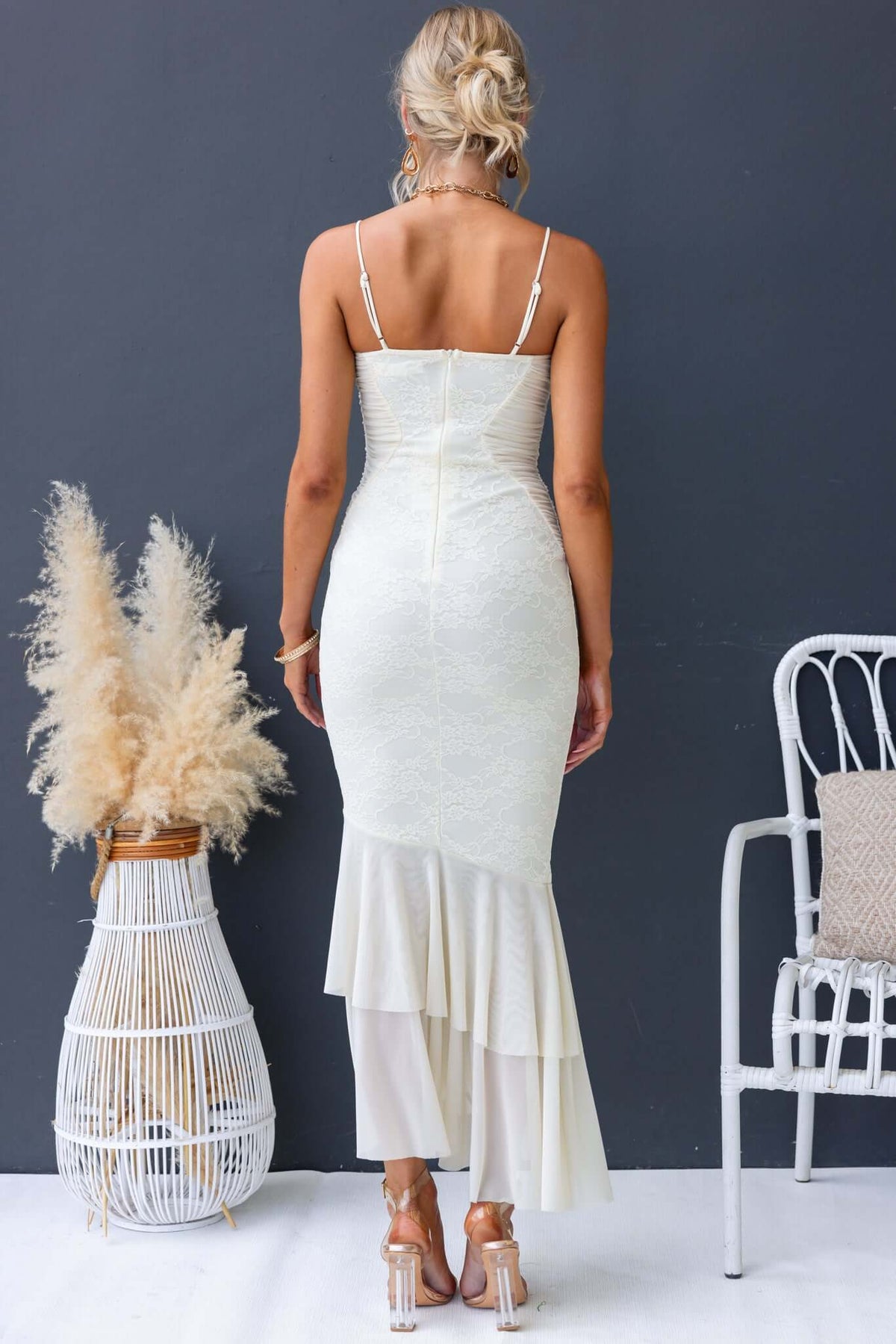 Back view of Marilou Maxi Dress featuring lace detailing and adjustable straps, showcasing its elegant fit and flair.