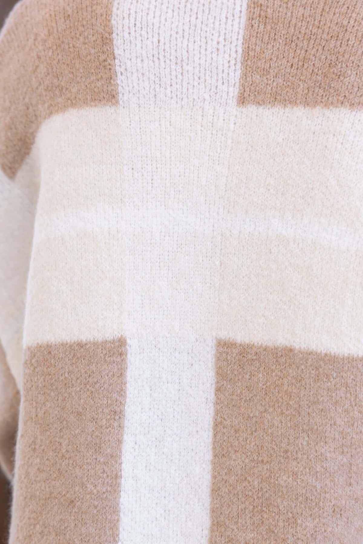 Close-up of Mason Cardigan featuring a knit pattern with beige and cream colors, showcasing collar and comfortable sleeves.
