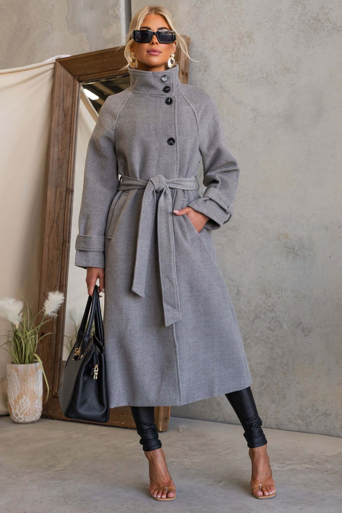 Model wearing the Modern Love Coat in gray with funnel neck, button closure, and removable belt.