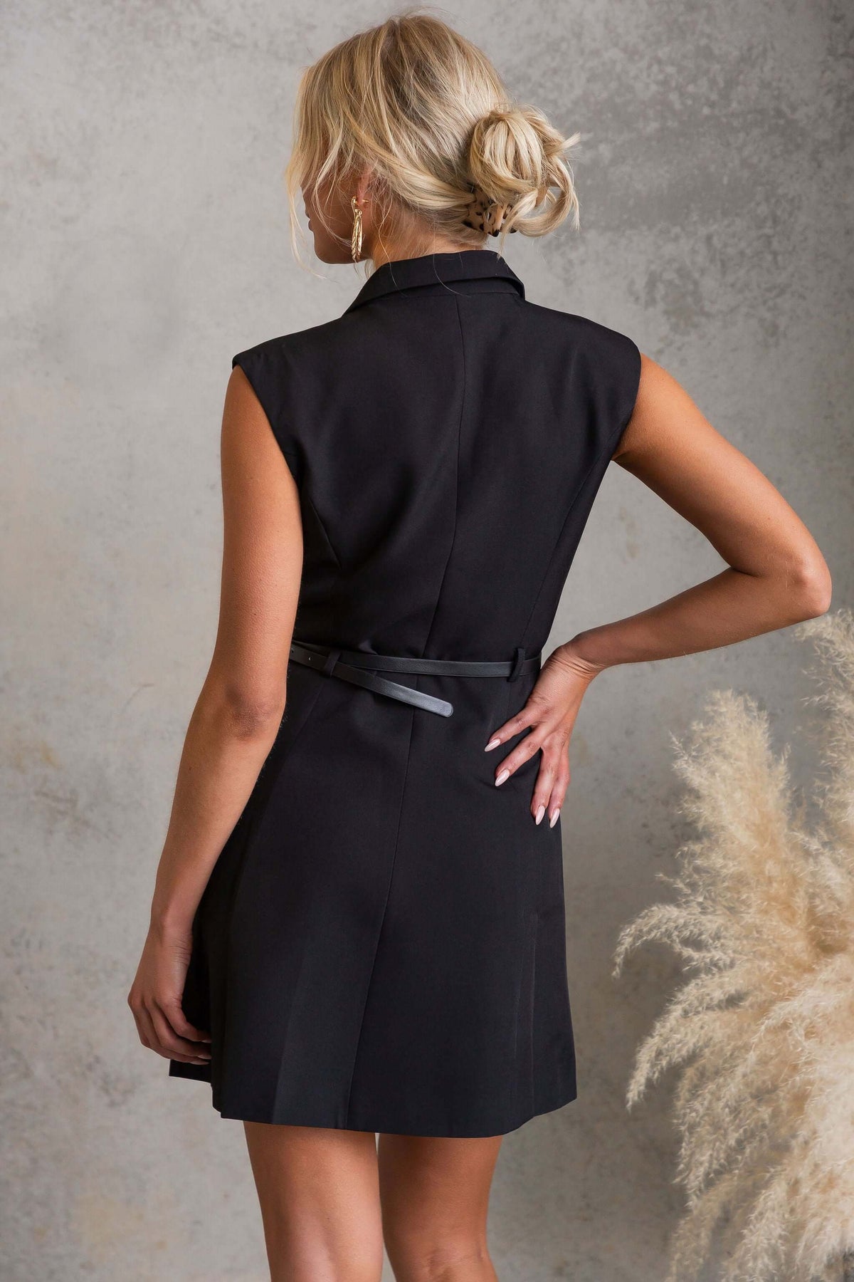 Moko Dress back view featuring black color, V-neckline, and removable belt for a stylish look.