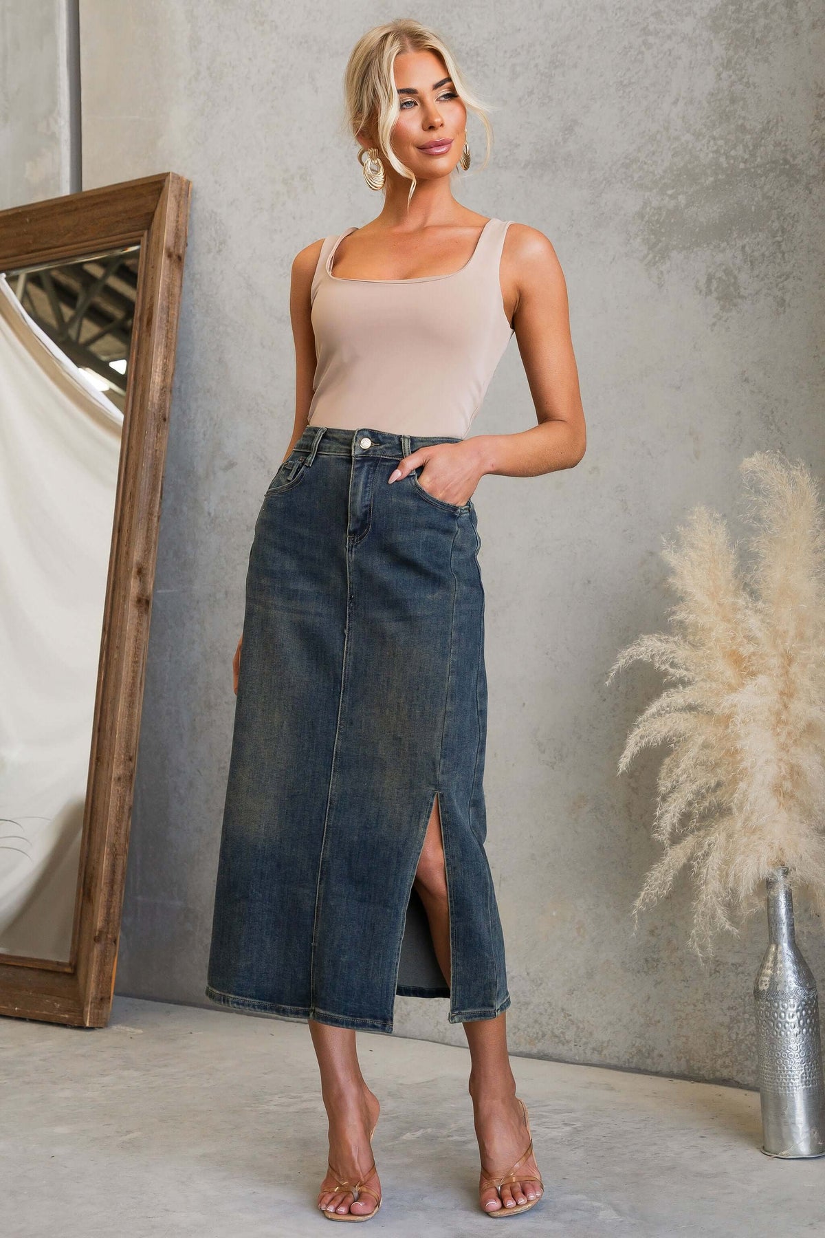 Moon Denim Midi Skirt displayed with a model featuring a split front and pockets, styled for a chic look.