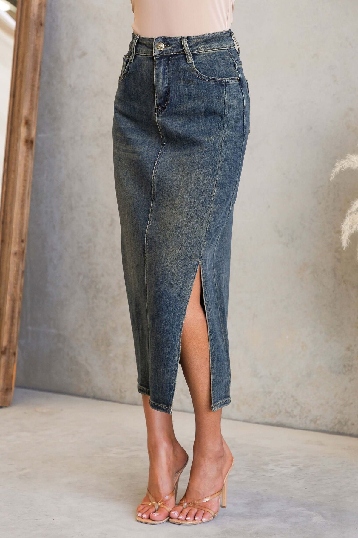 Moon Denim Midi Skirt featuring a mid-high waist, split front, and pockets in stretchy denim.
