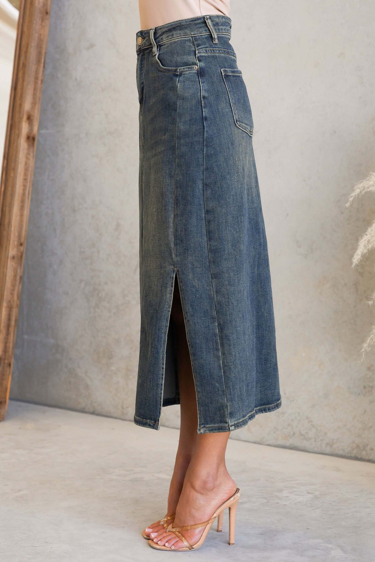 Moon Denim Midi Skirt showcased with a front split and mid-high waist, perfect for stylish summer looks.