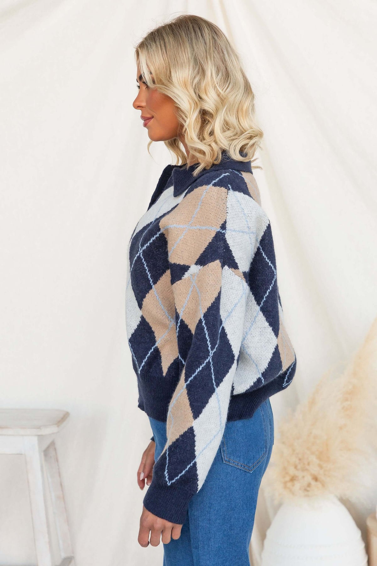 Vella Jumper in navy with a stylish collar and knit design, showcasing a trendy check pattern.