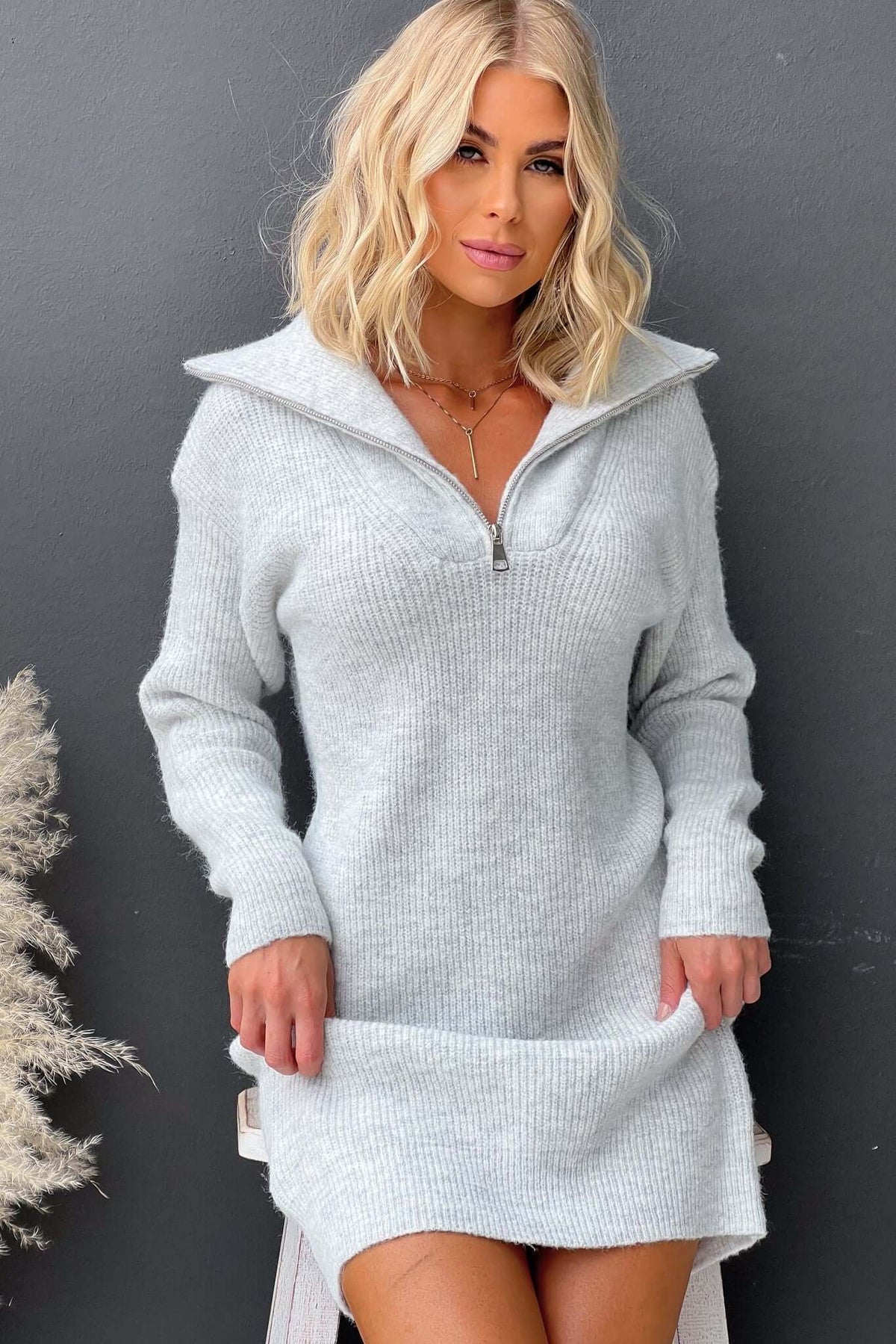 Nayeli Dress featuring a knit design, 1/4 zip collar, relaxed fit in soft ribbed material.
