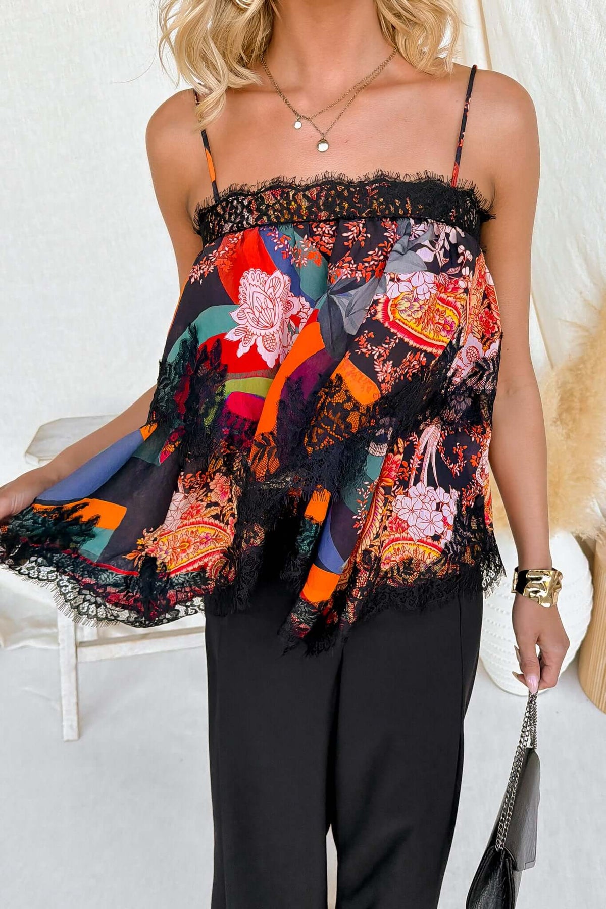 Nightingale Top featuring adjustable tie straps and colorful floral lace detail, perfect for a relaxed fit.