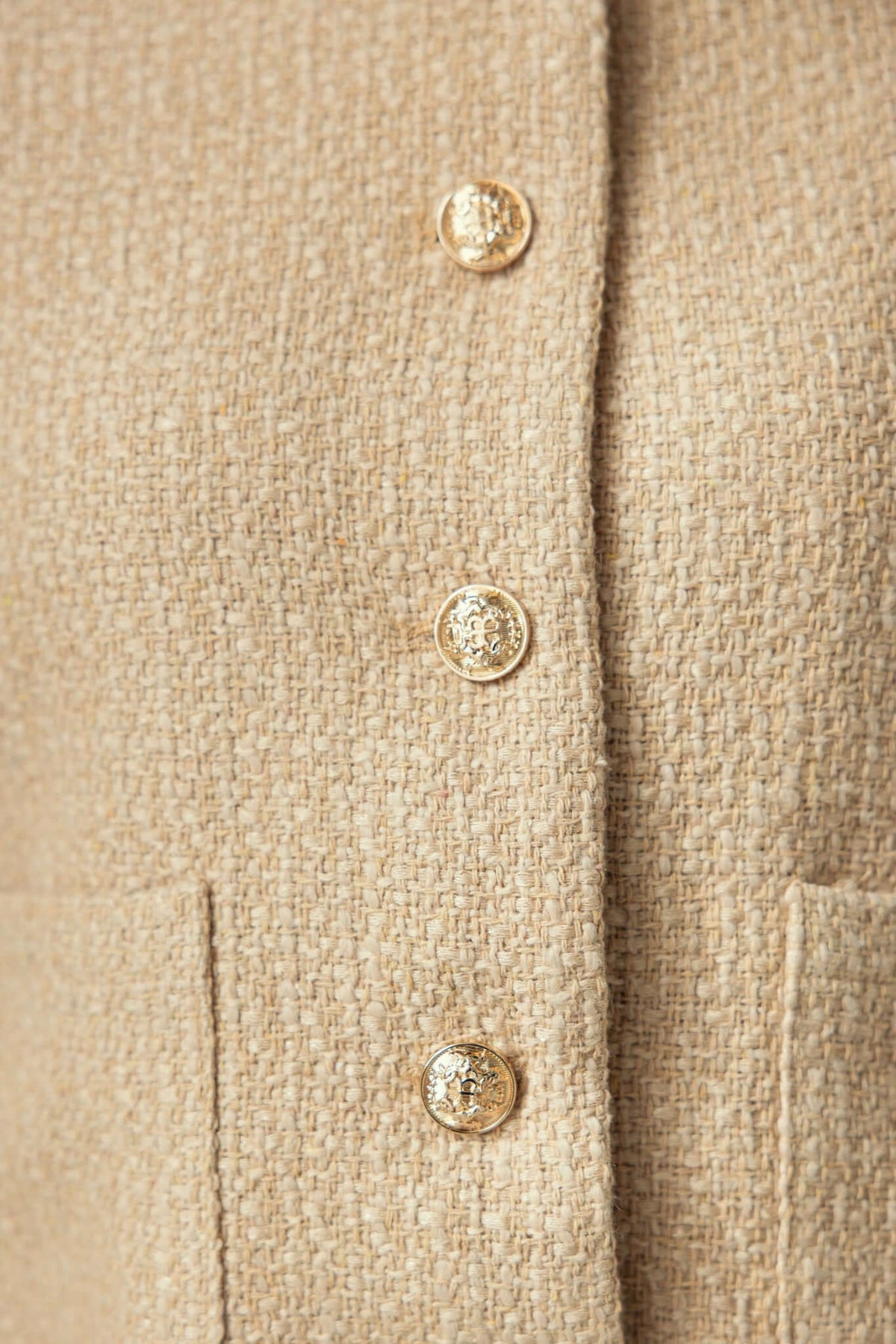 Close-up of Noelle Jacket showing button-up front and chenille fabric texture.