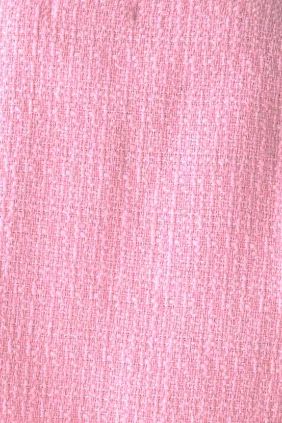 Close-up of pink chenille fabric texture used in Noelle Jacket, showcasing softness and color detail.