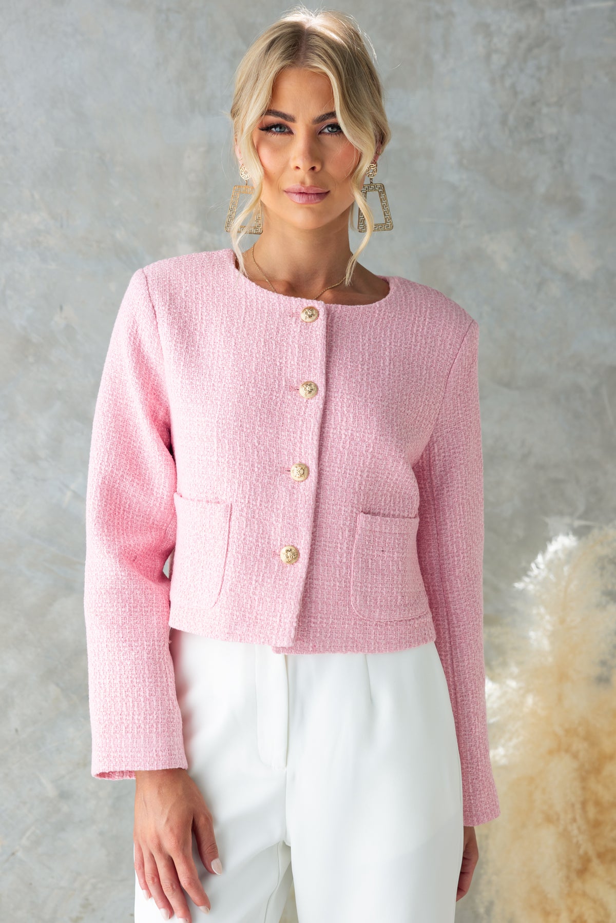 Stylish Noelle Jacket in pink chenille fabric, featuring button-up front, pockets, and shoulder pads.