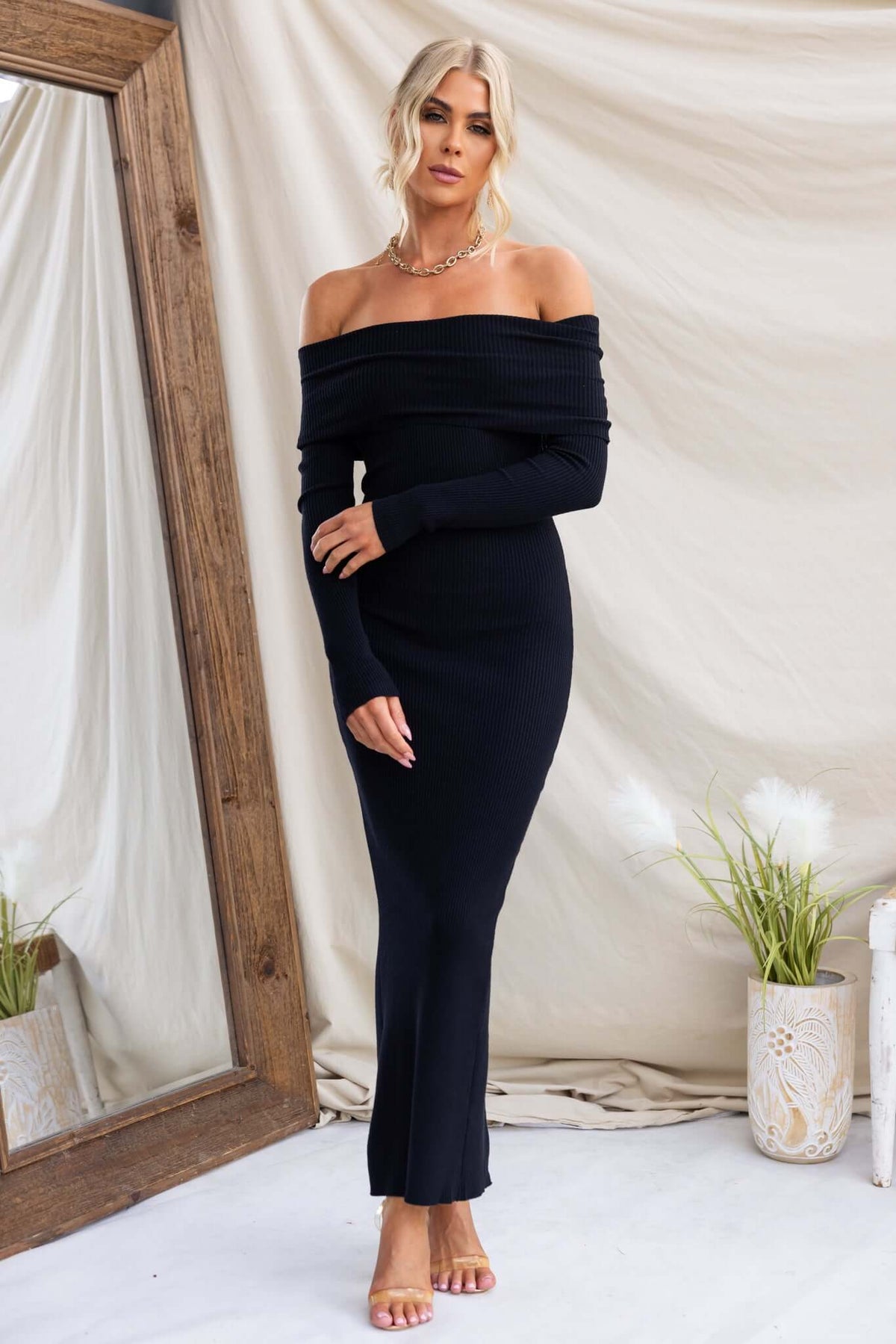 Oxnard Maxi Dress with off-shoulder neckline in ribbed knit material, featured in a stylish setting.