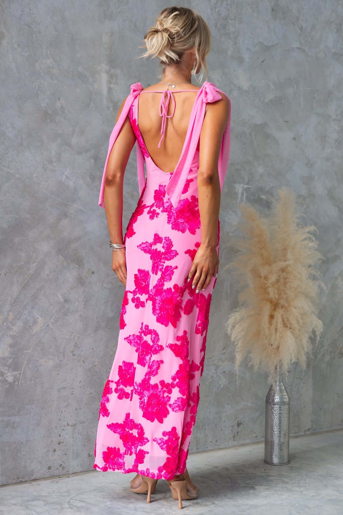 Back view of Parfait Maxi Dress with floral design, V-neckline, and tied straps, showcasing mesh material and elegant fit.