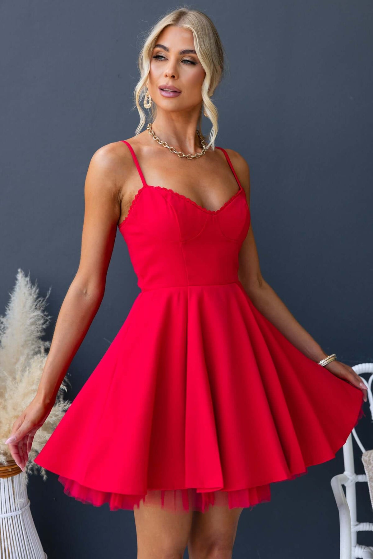 Pescia Dress in vibrant red with adjustable straps and tulle underlay, perfect for a stylish summer look.