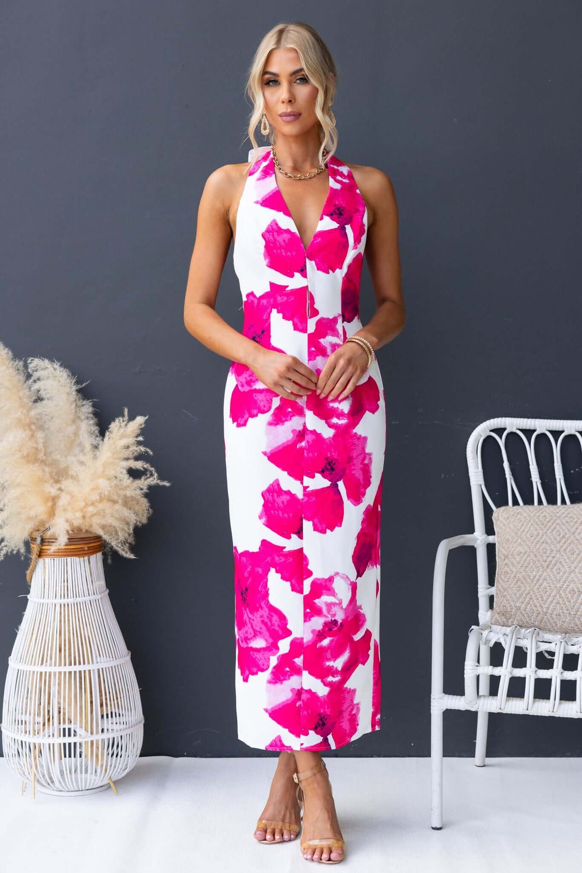 Pianni Maxi Dress with tie halter neckline and floral print in pink and white, perfect for summer occasions.