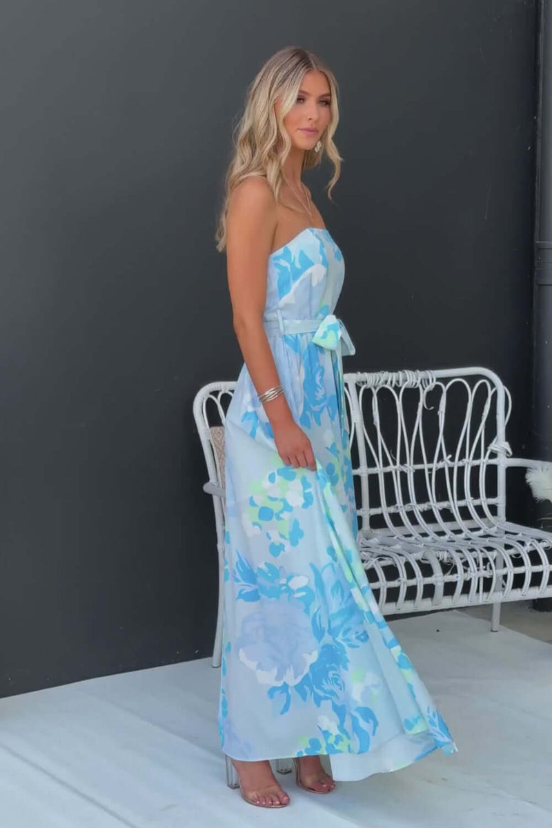 Strapless Notice Me Maxi Dress with floral print, featuring a removable belt and high splits, styled outdoors.