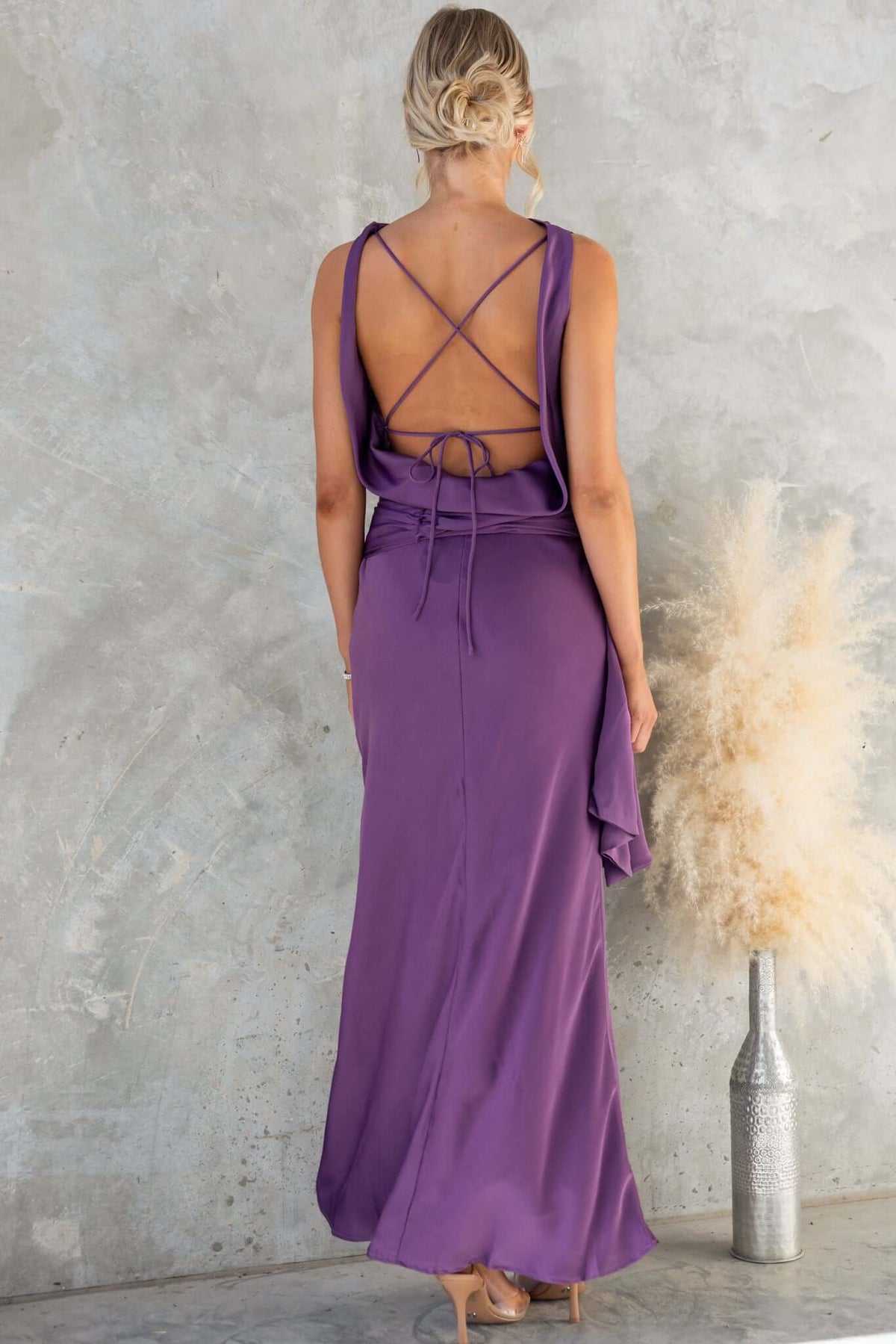 Qalenna Maxi Dress by Amaroso Bridal, showcasing an elegant high neckline and stylish open back with tie.