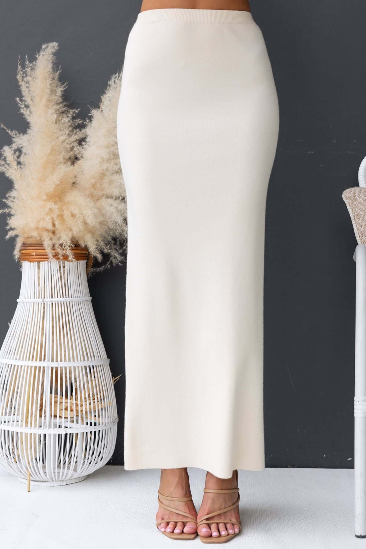 Qarmy Maxi Skirt in cream with a mid-high waist fit, made from stretchy knit material, perfect for casual styling.
