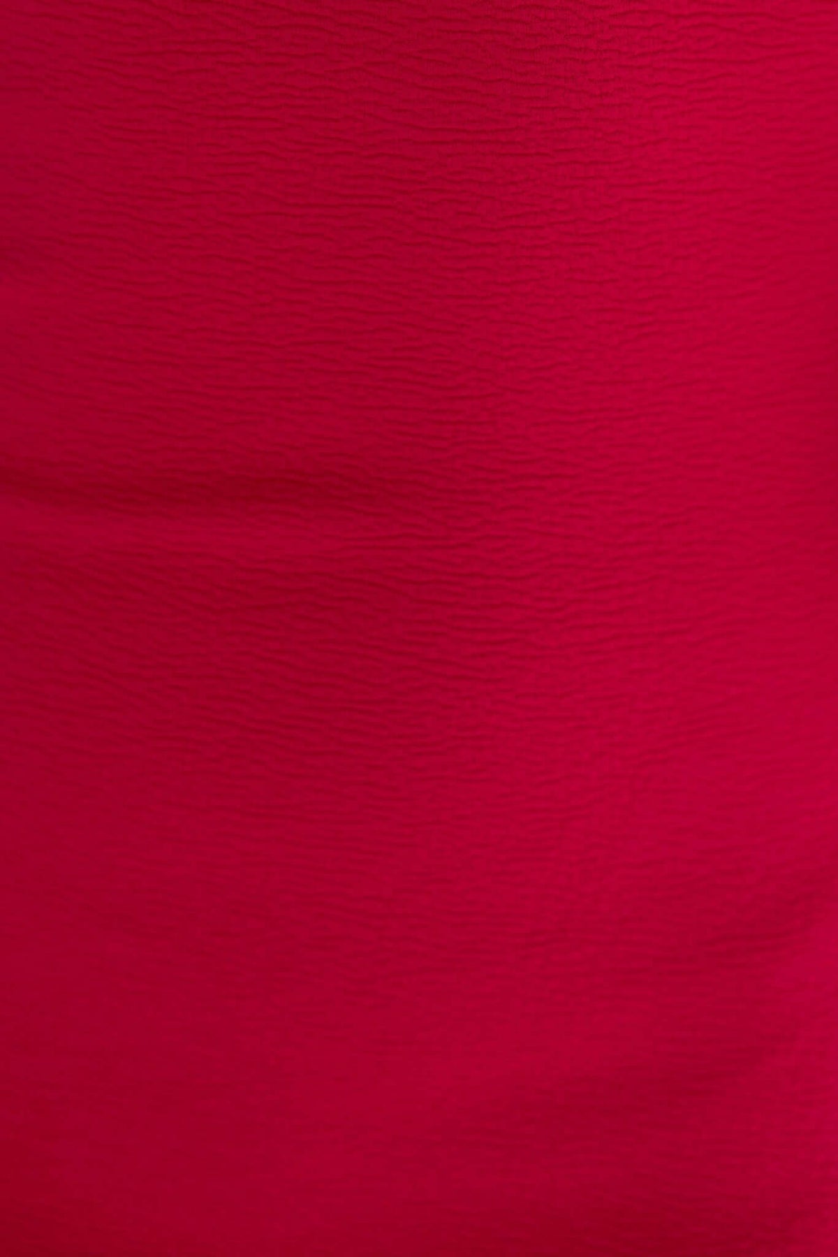 Close-up of soft red fabric texture of Raleigh Maxi Dress, highlighting the stretch material for comfort.