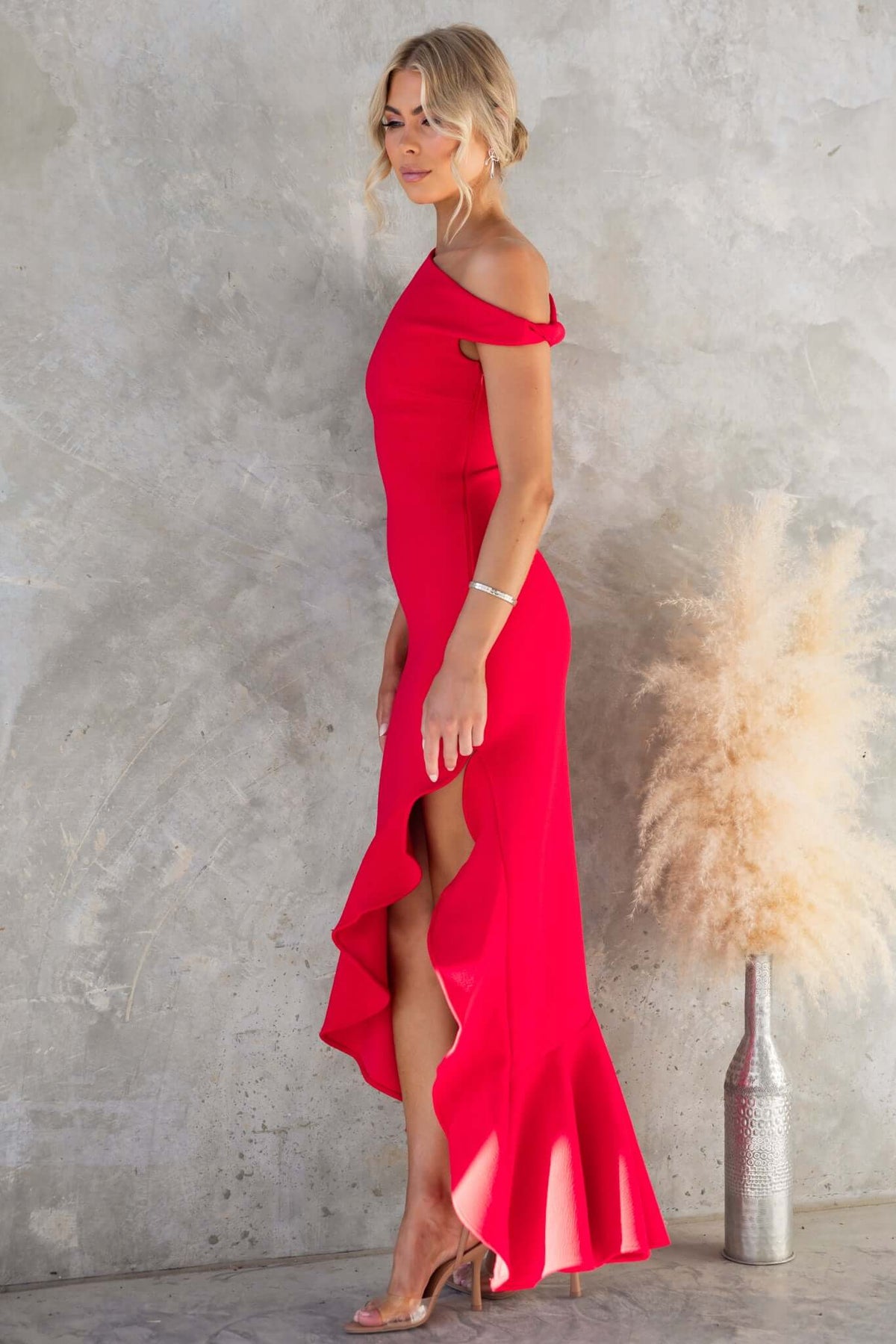 Raleigh Maxi Dress by Amaroso Bridal, featuring an asymmetric neckline, side zip, and stretch fabric in vibrant red.
