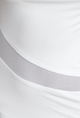 Close-up of white Millard maxi dress fabric featuring sheer panel details and draping material.