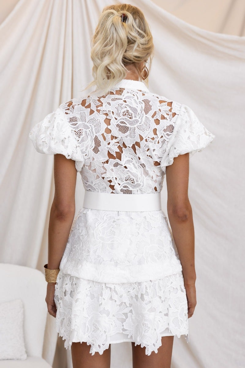 Back view of Javier Dress featuring soft lace, elastic cuffs, and removable faux leather belt on model.
