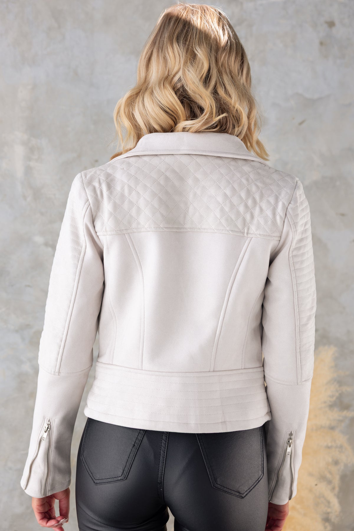 Back view of the Remind Me Jacket featuring quilted details, faux suede finish, and stylish collar design.