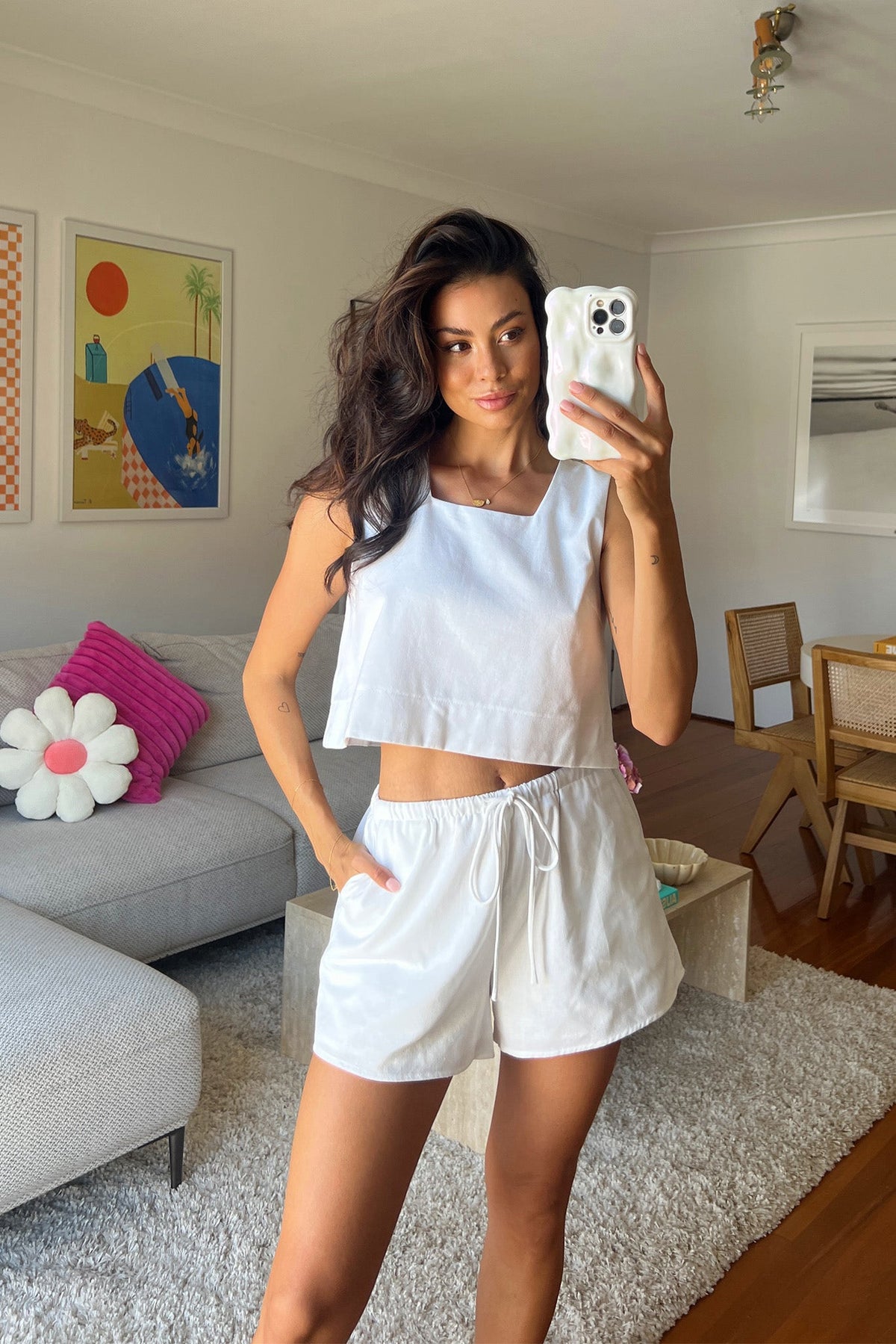Model wearing Tiann Shorts with elastic waistband and drawstring in a bright indoor setting.