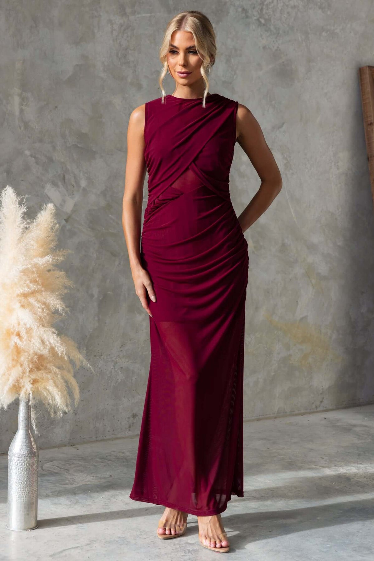 Rogers Maxi Dress in burgundy with high neckline and ruched detailing, made from stretchy mesh material.