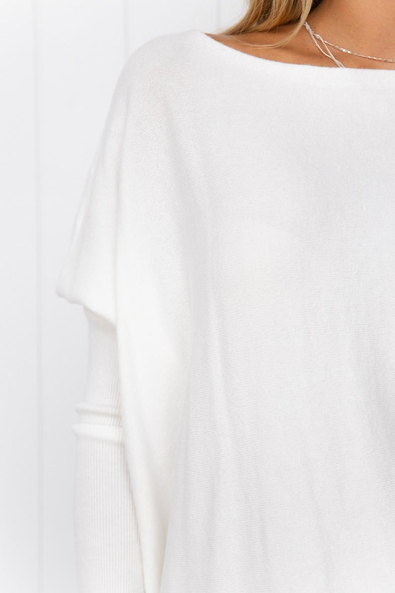 Close-up of Bonnie Knit oversized top in white, featuring full length sleeves and soft, stretchy 100% cotton material.