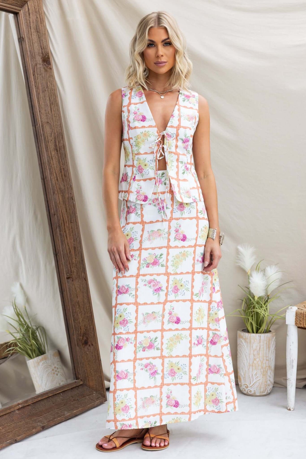 Shawnee maxi skirt in floral print, worn by blonde model, showcasing its mid-high waist and elegant design.