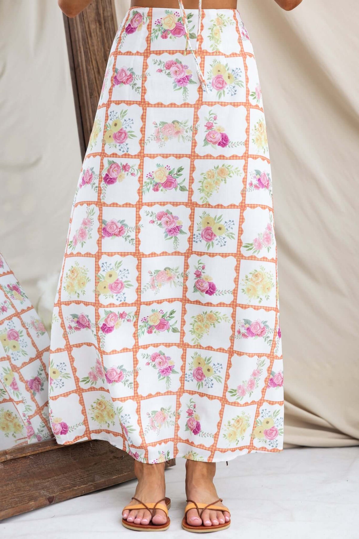 Shawnee Maxi Skirt featuring floral print, mid-high waist, and linen feel, perfect for summer fashion.