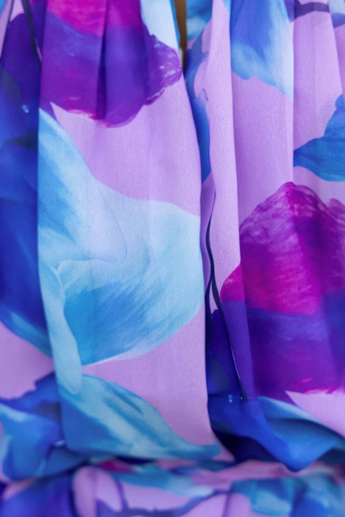 Siletto Dress featuring vibrant purple and blue floral fabric close-up detail.