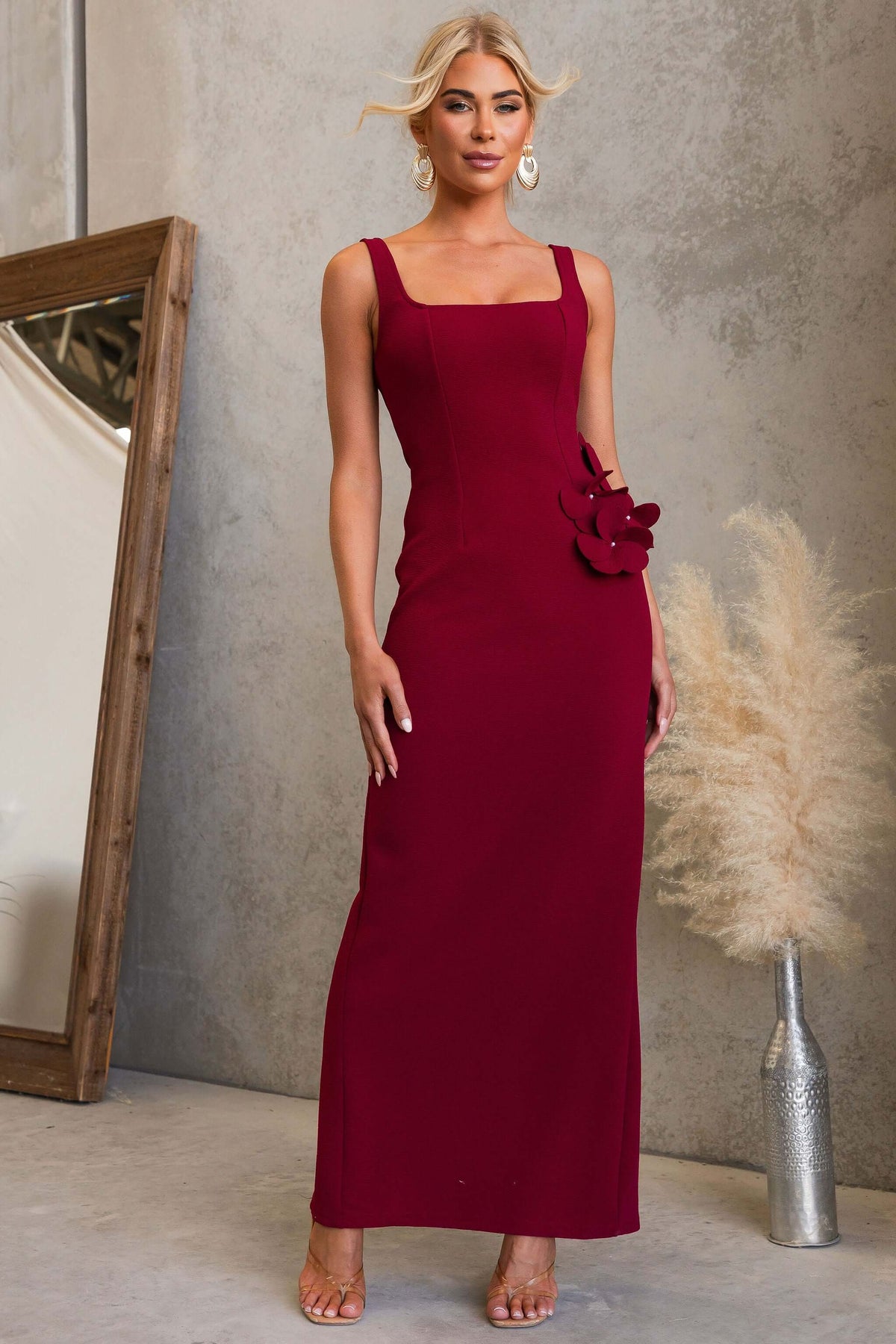 Sofia Maxi Dress in burgundy with square neckline and floral detail, showcasing elegant fit and textured material.
