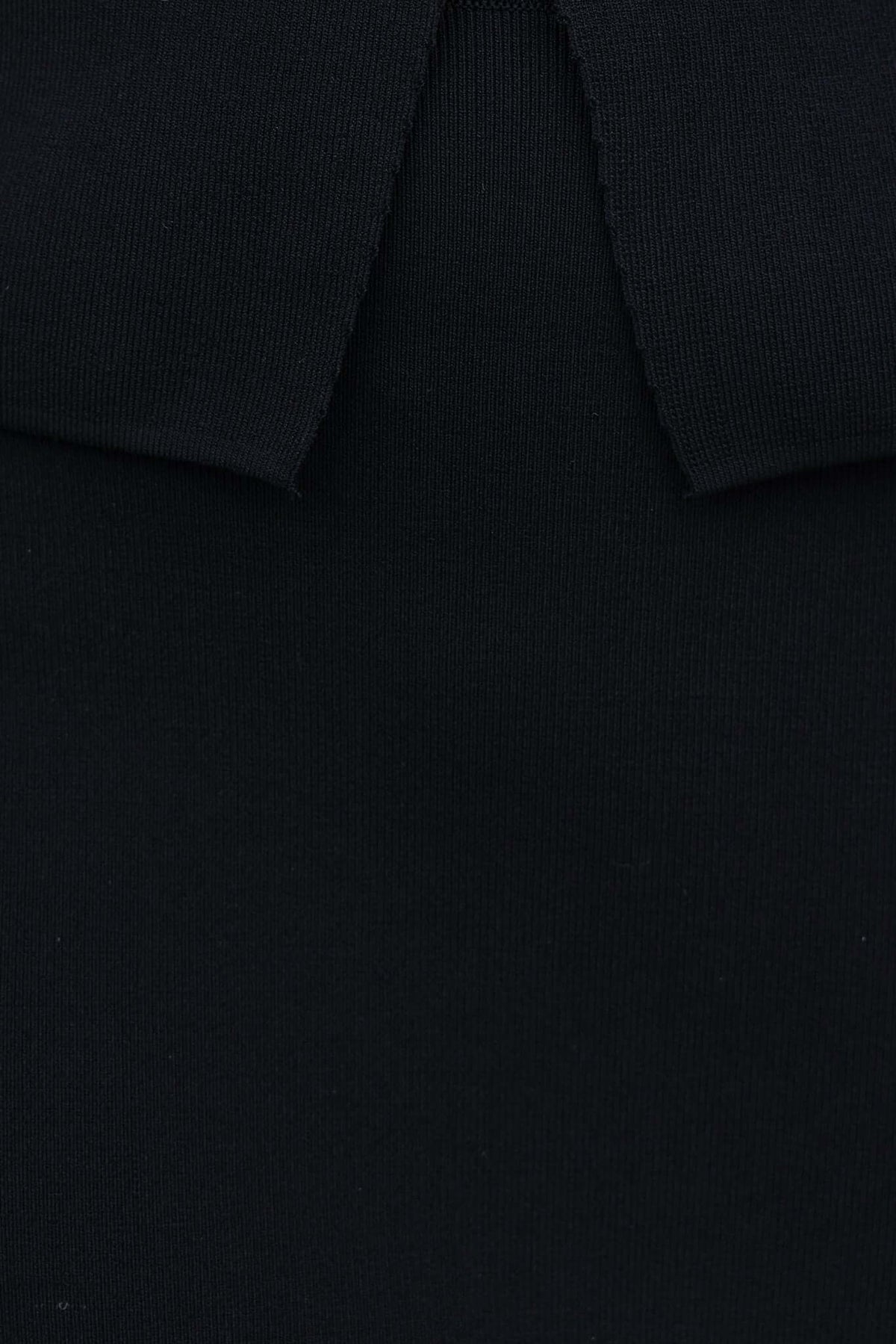 Close-up of Tammie Midi Skirt showing black knit fabric and collar detail; stylish and versatile for any occasion.