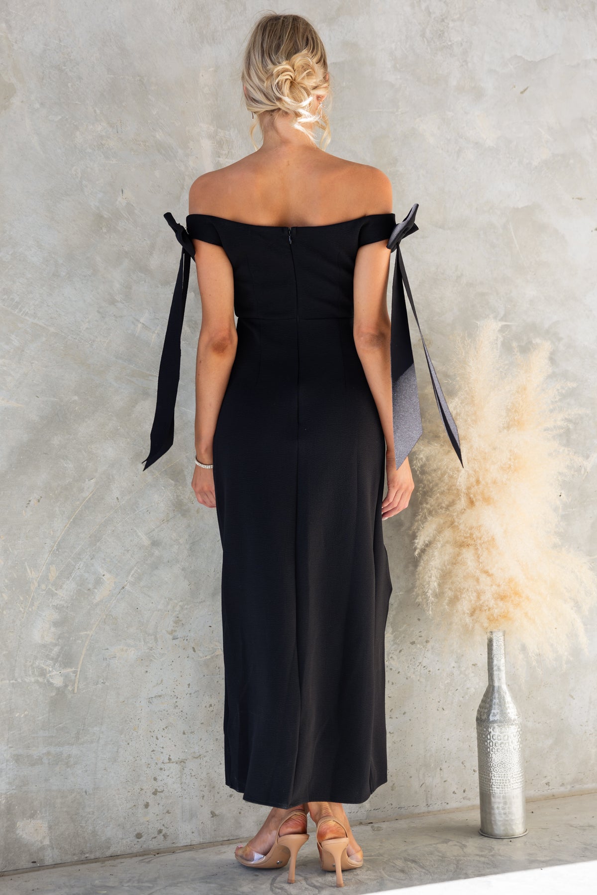 Tavisha Maxi Dress featuring off-shoulder design, removable shoulder brooches, and a sleek split at the back.
